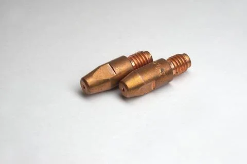 Welding contact tips pair. MIG/MAG. Threaded tail, tapered, shaped Stock Photos