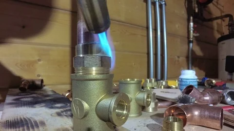 Welding of a copper pipe and fitting Stock Footage 101502246