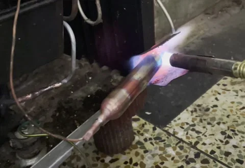 Welding of copper pipe with Butane gas Stock Footage 178479885