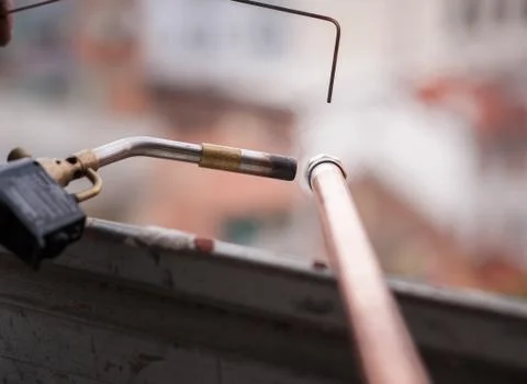 Welding of copper pipe. Stock Photos