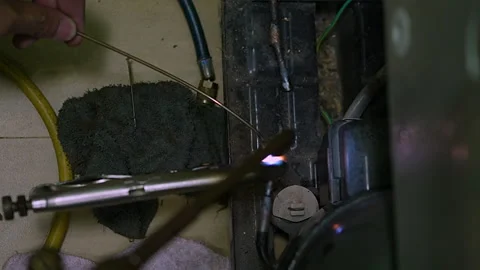 Welding of copper pipes with fire high temperature for refrigeration repair. Stock-Footage 225853014