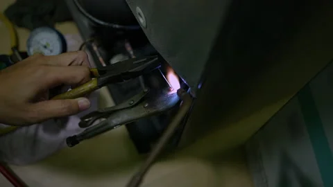Welding of copper pipes with fire high temperature for refrigeration repair. Stock Footage 225853428