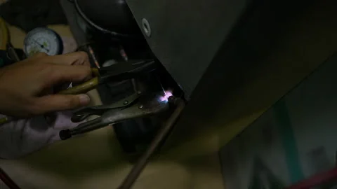 Welding of copper pipes with fire high temperature for refrigeration repair. Stock-Footage 225853856