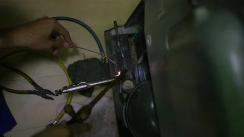Welding of copper pipes with fire high temperature for refrigeration repair. Stock-Footage 225853886