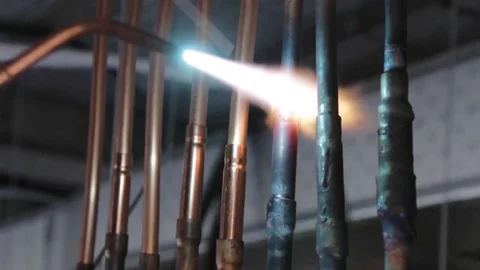 Welding copper tubes with oxidized flame Stock Footage 80811181