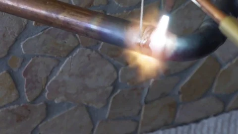 Welding copper tubes with oxidized flame Stock Footage 80811236
