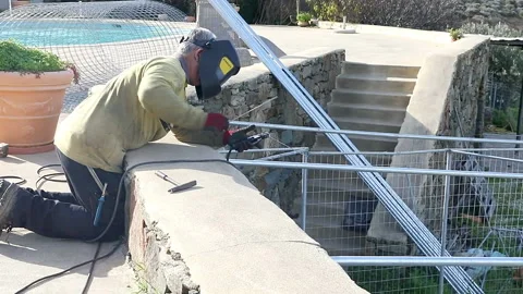 Welding A Dog's Kennel Stock Footage 138652904