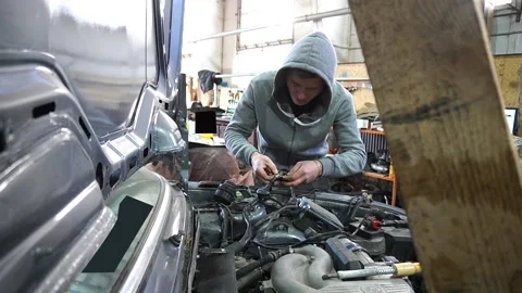 Welding of electrical wires is carried out by a mechanic 動画素材 222889360