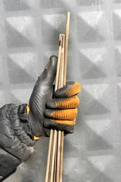Welding electrodes in the hands of the worker Stock Photos