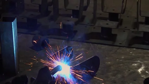 Welding fabrication process metal binding process up-close slow motion Stock Footage 320289565