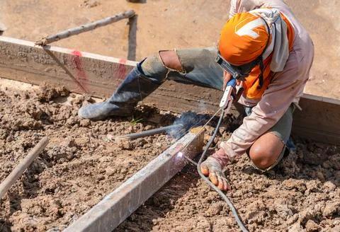 Welding formwork to lay the foundation for pour concrete. Stock Photos