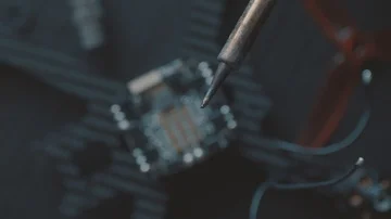 Welding FPV Racing Drone Brushless Motor on a ESC. Overhead Shot. Stock Footage 85478978