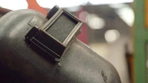 Welding helmet in factory Stock Footage 77099634