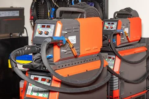 Welding machines are set up in a workshop for metal fabrication work in the.. Stock Photos