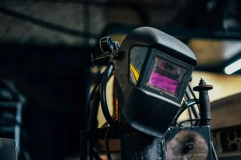 Welding mask on garage workshop background Stock Photos