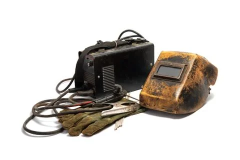 Welding mask with welding machine, protective gloves, and arc steel electrode Fotos Stock