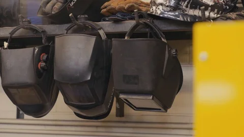 Welding masks on hooks Stock Footage 103337294