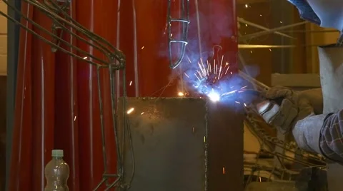 Welding metal welding machine. Spatter, work gloves melt metal iron construction Stock Footage 49860557