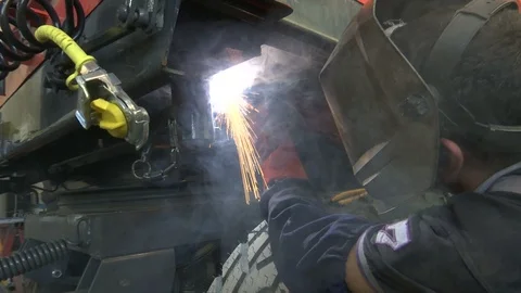 Welding a part of tractor trailer Stockbeeldmateriaal 88768314