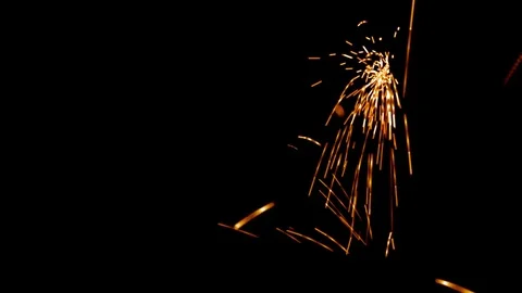 Welding Particles Falling On A Black Background Stock Footage 76466160