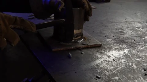 Welding Pick and Brush Removing Slag. Angled from the Side. Slow Motion Stock Footage 254744587