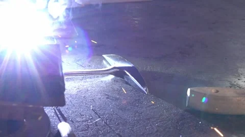 Welding Pick in a Workshop. Profile angle. Slow Motion Stock Footage 254744579