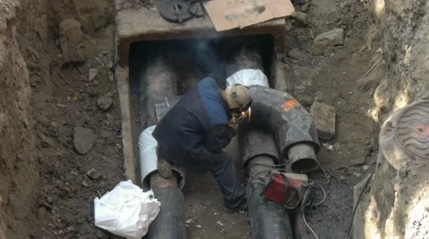 Welding pipe, welder left Stock Footage 35624623