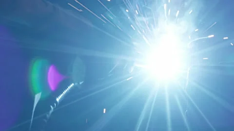Welding process creates bright light that is reflecting on the workers uniform Stock Footage 171969308