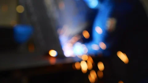Welding process in a dark workshop bokeh blurred. Stock Footage 122559563