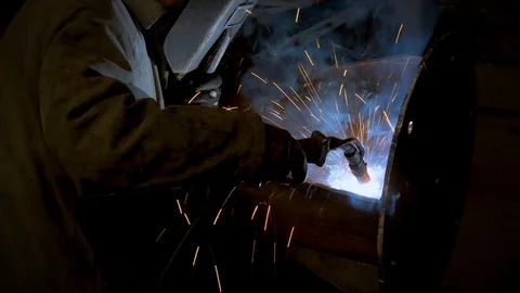 Welding process on old metalworking factory, welder in mask working Stock Footage 108208361