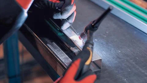Welding process of steel profiles for the construction of packaging machines Stock Photos