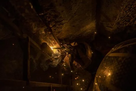 Welding process from a top angle with golden light Fotos Stock