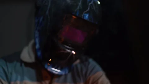 Welding process using a protective face mask. Stock Footage 221880695