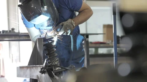 Welding process. Welder in helmet works, worker works in the auto workshop. Stockbeeldmateriaal 139285733