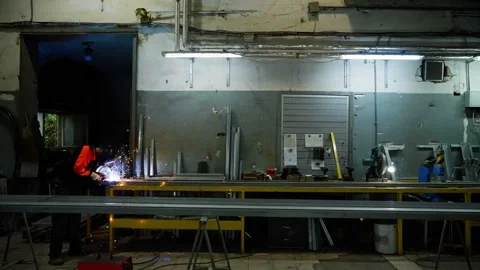 Welding Professional Assembling Metal Constructions in Factory Stock Footage 317151989