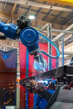 Welding robot in the process. Modern welding production Stock Photos