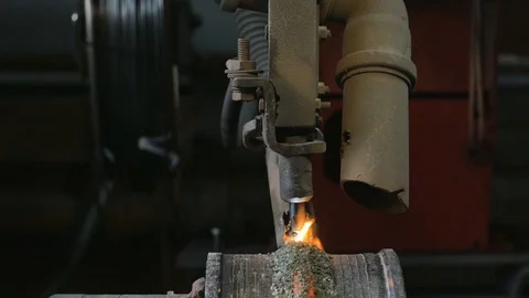 Welding robots apply overlay weld protection on the pipe disks. Automatic Stock Footage 84833734