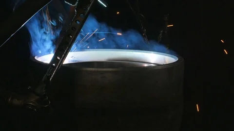 Welding robots apply overlay weld protection on the pipe disks. Automatic Stock Footage 84835877