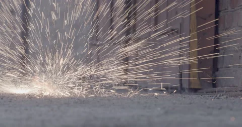 Welding sparks falling to the ground close up. Stock Footage 135754057