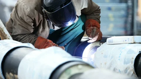 Welding steel pipe on a modern construction site Stock Footage 88995427
