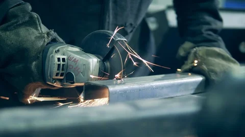 Welding technician is cutting iron beam with a saw Video stock 124259865