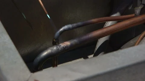 Welding Torch being used on pipes.  HVAC unit installation. Stock Footage 64053493