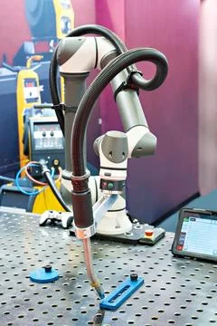 Welding torch of robotic manipulator with control panel Stock Photos