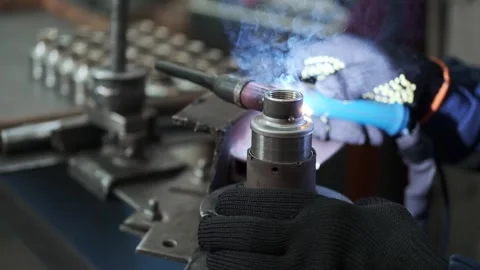 Welding of a turned fitting Stock Footage 259304617