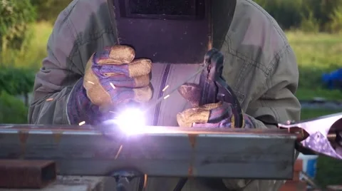 Welding two pieces of electric welding in the street in the summer close-up 스톡 동영상 66439050