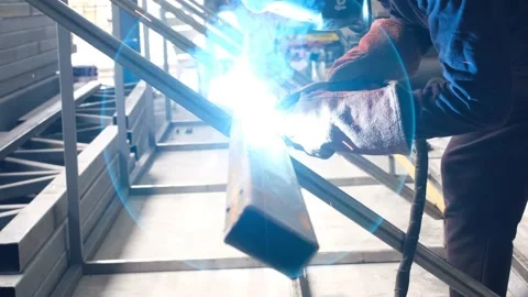 Welding, welder is welding in small workshop Stock-Footage 163891344