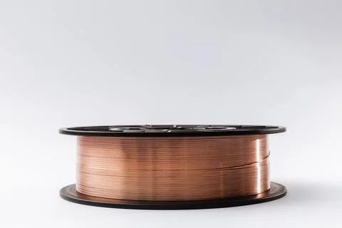 Welding wire spool on a white background Foto stock