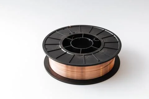 Welding wire spool on a white background Foto stock