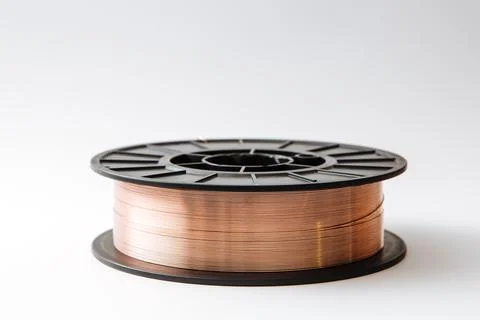 Welding wire spool on a white background Foto stock