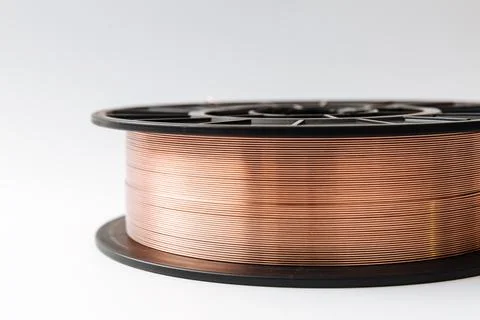 Welding wire spool on a white background Foto stock